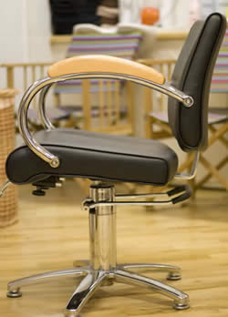 Photograph of a stylists chair at Backstage Hair Cutters